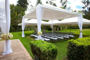 outdoor tent on grass with chairs
